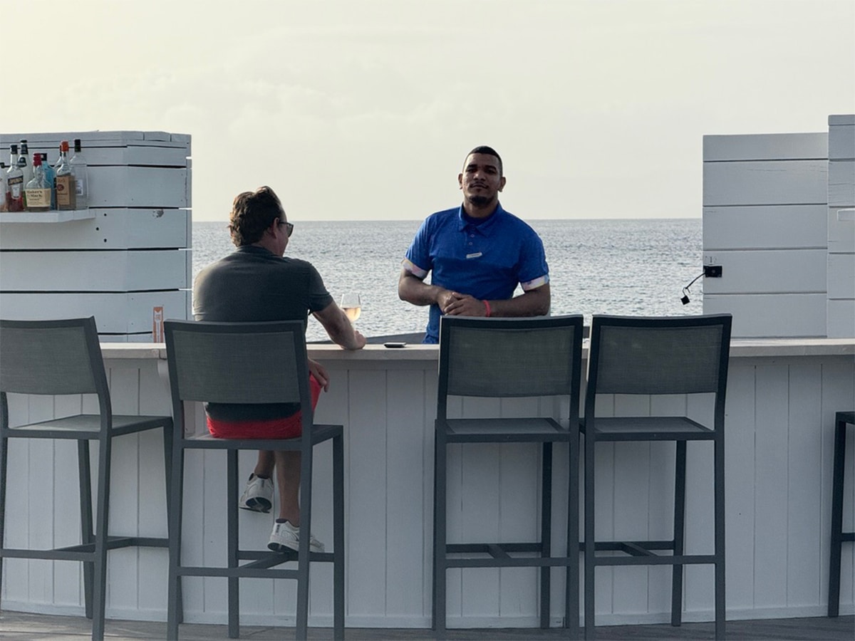 This Caribbean Four Seasons Resort Has a Secret Overwater Bar That’s Only Open for Sunset 